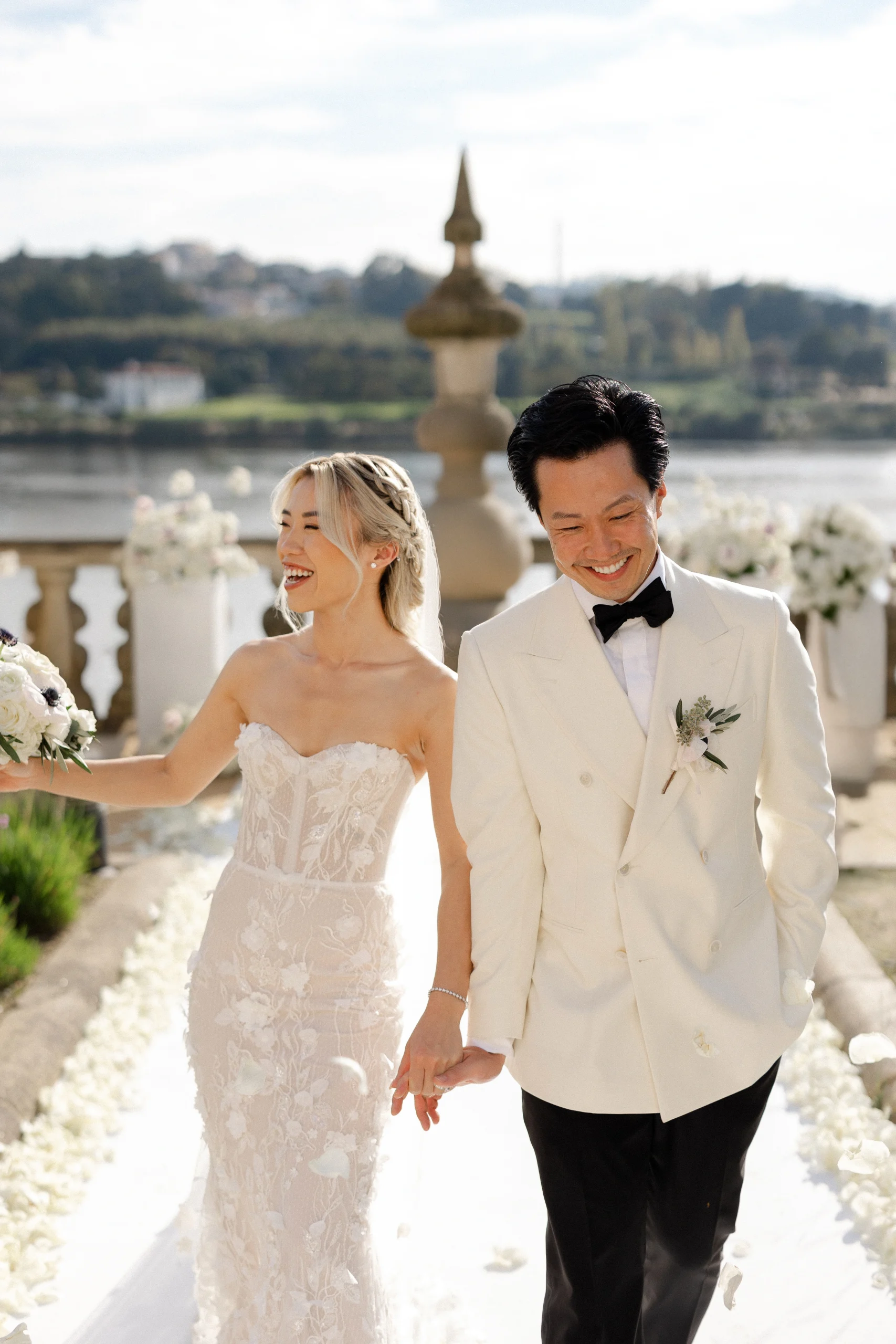 Chinese couple smiling during their destination wedding in the Douro Valley, Portugal